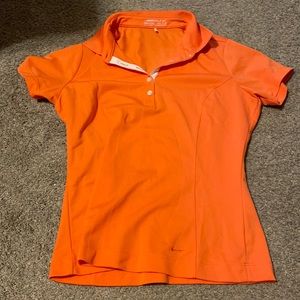Orange Nike women’s golf shirt